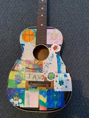 student gift to teacher of a decorated guitar