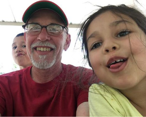 Tom Gilbert with silly selfie of grandkids June 2016