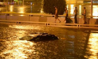 Car caught in Albuquerque downtown flooded street