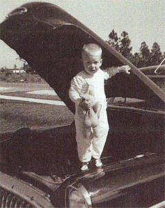 Tom Gilbert at age 2 under the hood of the family car